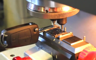Car key being cut on a key cutting machine in Stockport